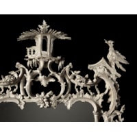 A RARE CHIPPENDALE PERIOD CARVED AND PAINTED MIRROR  Retaining its original white painted decoration