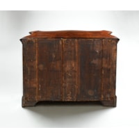 A PAIR OF GEORGE II PERIOD SERPENTINE FRONTED MAHOGANY COMMODES ATTRIBUTED TO THE WORKSHOP OF WILLIAM VILE OR WILLIAM HALLETT THE CARVING POSSIBLY BY JOHN BOSON