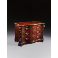 A PAIR OF GEORGE II PERIOD SERPENTINE FRONTED MAHOGANY COMMODES ATTRIBUTED TO THE WORKSHOP OF WILLIAM VILE OR WILLIAM HALLETT THE CARVING POSSIBLY BY JOHN BOSON