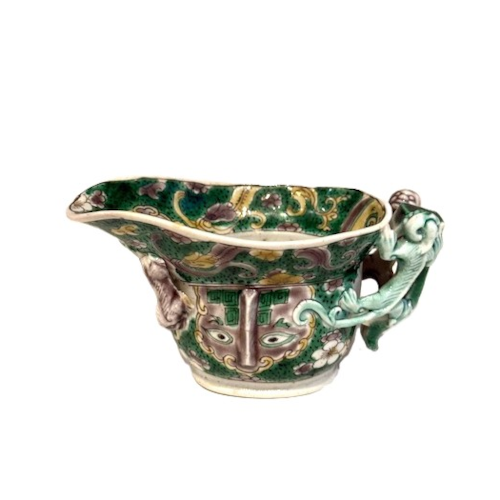 Bowl of libatory biscuit decorated with "shi" dragons and masks and prunus flowers in enamels from the Famille Verte China period Kangxi 1662/1722