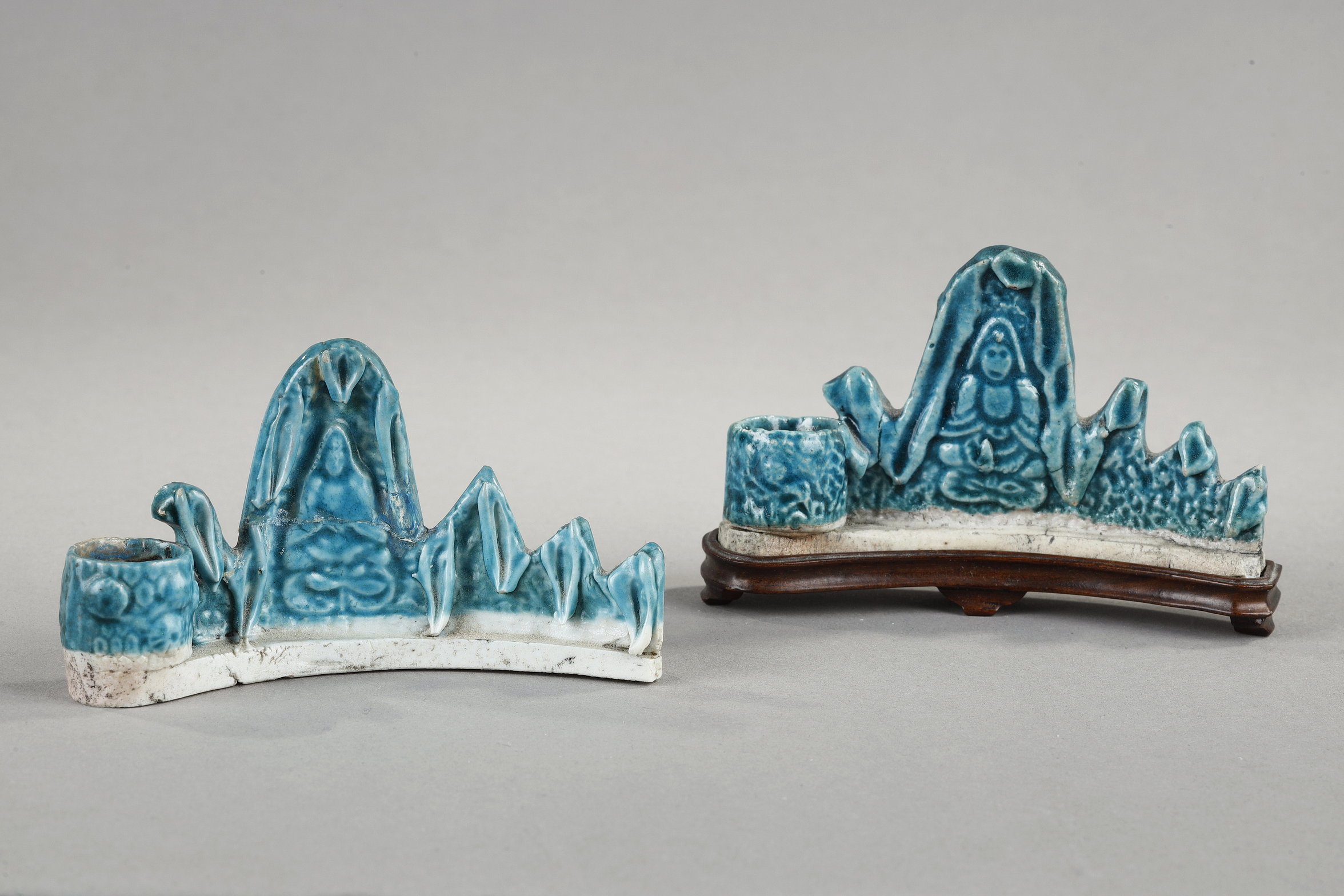 Two  turquoise blue biscuit brushes rest in the shape of a mountain, a Guanyin in a grotte  and a small  brush washer in the shape of pine trees -
China Kangxi 1662/1722 
long 9cm