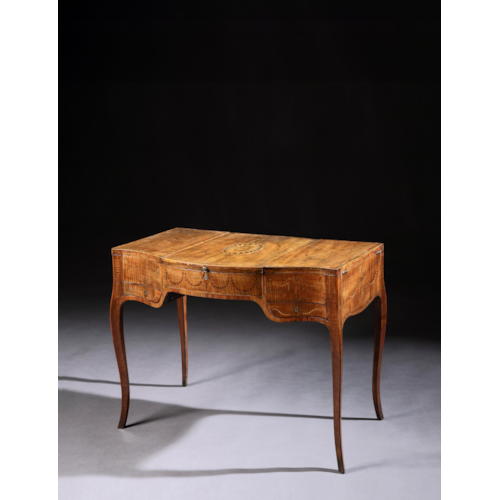 A George III Period Fiddleback Sycamore and Marquetry Dressing Table
In the Manner of Mayhew and Ince