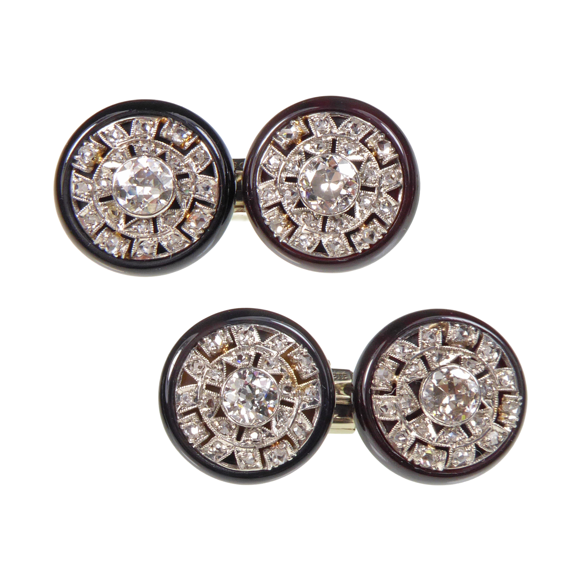Pair of early 20th century round diamond and onyx cluster cufflinks, c.1915,